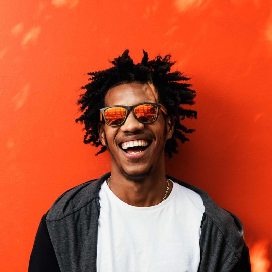 portrait-of-handsome-afro-man-using-his-mobile-EDDNTK6-1.jpg